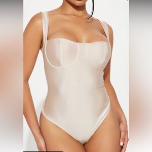 new without tags- never worn. Champagne color bodysuit